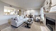 Located at 1010 N Ridge Rd in Wichita, Kansas, this single-floor, three-bedroom, two-bathroom home offers a well-organized layout with a warm, farmhouse-inspired aesthetic throughout. The open living and dining area serves as the heart of the home, featuring a tiled fireplace as a central focal point, recessed lighting, neutral tones, and windows that invite natural light. A door provides direct outdoor access from the living space. The kitchen is designed in a functional U-shape, offering ample white cabinetry with wood-trimmed accents, generous counter space, and wood-look flooring, making it both practical and visually cohesive. The primary bedroom is a comfortable retreat with carpeted floors, natural light from a window, and direct access to the main living area. The two additional bedrooms are similarly appointed with carpet, windows, and closet access. Both bathrooms feature wood-look flooring, vanities with storage, and shower-tub combinations. A dedicated laundry room provides in-unit washer and dryer hookups with overhead shelving for added storage. Three closets throughout the home ensure ample storage. The overall ambiance is clean, bright, and inviting, with a consistent neutral palette that ties each room together seamlessly.