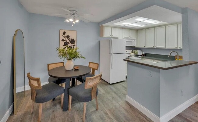 Building Photo - Turnkey ground floor condo in the coveted ...
