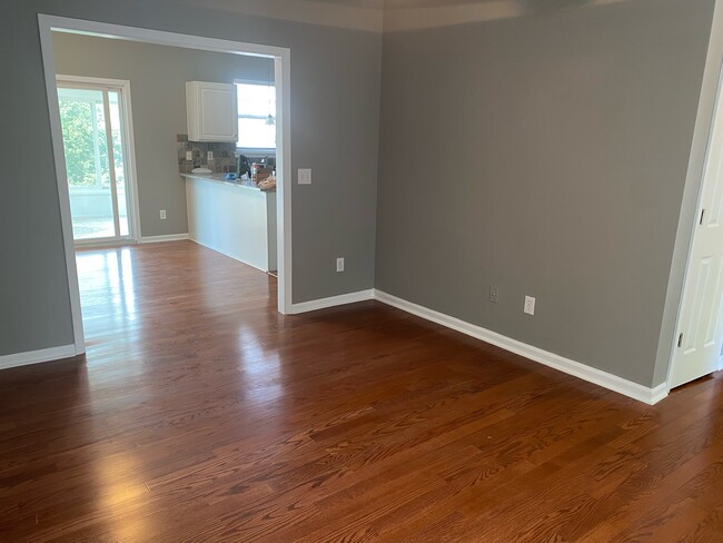 living room looking toward dining room and kitchen - 708 E 8th St