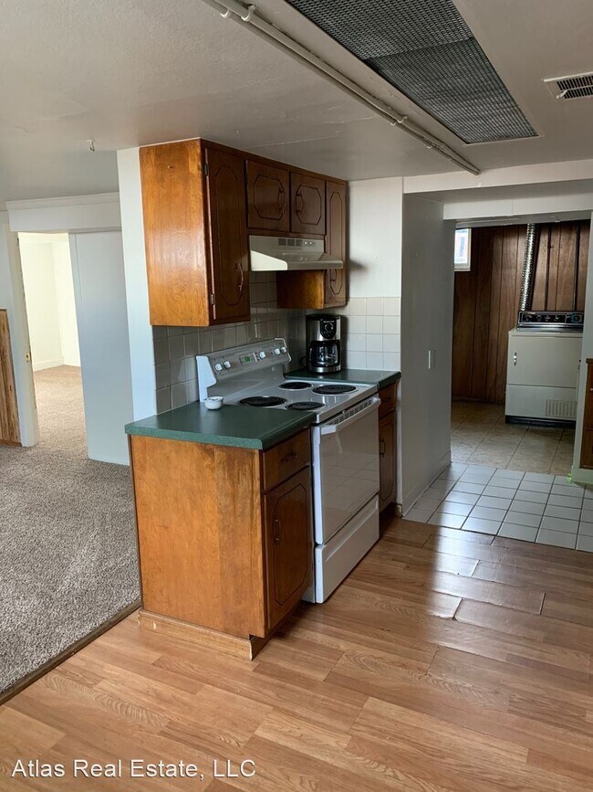 Foto del edificio - 1201-1211 E 62nd Ave