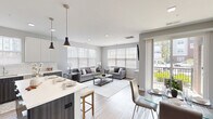 Located at 110 Woodcrest Rd in Cherry Hill, NJ, this thoughtfully designed single-floor residence offers 2 bedrooms and 2 bathrooms within a well-proportioned, open-concept floor plan. Light wood-tone flooring flows seamlessly throughout, complemented by a neutral gray-and-white color palette that creates a clean, modern ambiance.

The combined kitchen and living area serves as the heart of the home. The kitchen features two-tone cabinetry — dark lower cabinets paired with crisp white uppers — white quartz countertops, a subway tile backsplash, and stainless steel appliances. A central island with pendant lighting bridges the kitchen to the open dining and living areas, which are bathed in natural light from large windows overlooking the outdoors.

The spacious primary bedroom includes a ceiling fan, hardwood-style flooring, and direct access to a well-appointed en-suite bathroom featuring a long vanity with white countertop, dark cabinetry, and a mirrored medicine cabinet. The second bedroom is equally comfortable, also offering a ceiling fan and ample closet access. A second bathroom with tile flooring and a dark-toned vanity serves guests and residents alike. A hallway closet and additional storage add practical functionality to this polished, move-in-ready home.