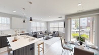 Located at 110 Woodcrest Rd in Cherry Hill, NJ, this thoughtfully designed single-floor residence offers 2 bedrooms and 2 bathrooms within a well-proportioned, open-concept floor plan. Light wood-tone flooring flows seamlessly throughout, complemented by a neutral gray-and-white color palette that creates a clean, modern ambiance.

The combined kitchen and living area serves as the heart of the home. The kitchen features two-tone cabinetry — dark lower cabinets paired with crisp white uppers — white quartz countertops, a subway tile backsplash, and stainless steel appliances. A central island with pendant lighting bridges the kitchen to the open dining and living areas, which are bathed in natural light from large windows overlooking the outdoors.

The spacious primary bedroom includes a ceiling fan, hardwood-style flooring, and direct access to a well-appointed en-suite bathroom featuring a long vanity with white countertop, dark cabinetry, and a mirrored medicine cabinet. The second bedroom is equally comfortable, also offering a ceiling fan and ample closet access. A second bathroom with tile flooring and a dark-toned vanity serves guests and residents alike. A hallway closet and additional storage add practical functionality to this polished, move-in-ready home.