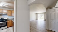 Located at 133 Sherwood Dr S in Middletown, NY, this one-bedroom, one-bathroom unit offers a thoughtfully organized single-floor layout. The living area is bright and open, featuring light-toned hardwood-style flooring and a large sliding glass door that floods the space with natural light and provides views of the surrounding greenery. The clean white walls and angled ceiling detail near the entryway add architectural interest to the room.

The kitchen is well-equipped with warm honey-toned shaker-style cabinetry, granite-look countertops, and a full suite of stainless steel appliances, including a gas range, dishwasher, and refrigerator. Marble-style tile flooring and a window offering natural light make the kitchen both functional and inviting.

The bedroom is a comfortable size, featuring plush carpeting, a window with outdoor views, and two double-door closets that provide generous storage. The neutral color palette creates a calm, restful atmosphere.

The bathroom features a full soaking tub with a tiled surround in soft gray tones, complemented by chrome fixtures for a clean, polished finish. Two hallways connect the rooms efficiently, contributing to a practical and well-flowing floor plan throughout the unit.