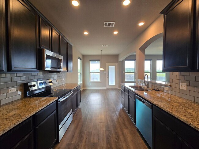 Building Photo - LARGE RENT REDUCTION - AVAILABLE NOW!