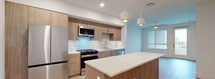 This contemporary 570 square foot apartment in San Diego offers a thoughtful layout maximizing space and functionality. The heart of the home is a modern kitchen, boasting wooden cabinetry, stainless steel appliances, and a stylish backsplash. The open-concept design seamlessly connects the kitchen to the living area, creating an inviting atmosphere for both relaxation and entertaining.

The 130 square foot bedroom provides a cozy retreat, featuring large windows that flood the space with natural light and offer picturesque views. The bathroom is elegantly appointed with a glass-enclosed shower, modern fixtures, and ample storage.

Throughout the apartment, light wood flooring and white walls create a bright, airy ambiance. Recessed lighting and pendant fixtures add both style and illumination. The efficient floor plan makes the most of every square foot, with clever storage solutions integrated throughout.

This single-floor residence is ideal for those seeking a low-maintenance, high-style urban living experience. Its location at 3585 Aero Ct. in San Diego places residents in the heart of the city, offering the perfect blend of comfort and convenience.