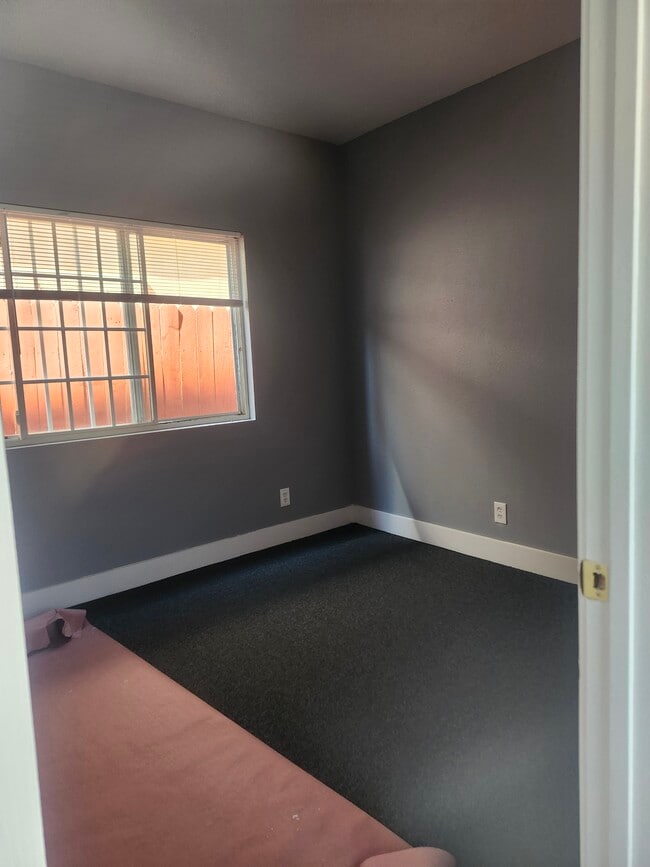 One of 3 bedrooms - 10609 S Main St