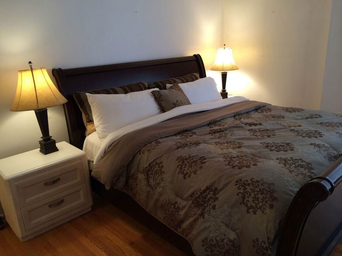 Spacious bedroom with a king size bed set with foam mattress - 8200 E Jefferson Ave