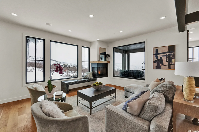 Living room with fireplace and mountain views - 732 S Nebo Cir