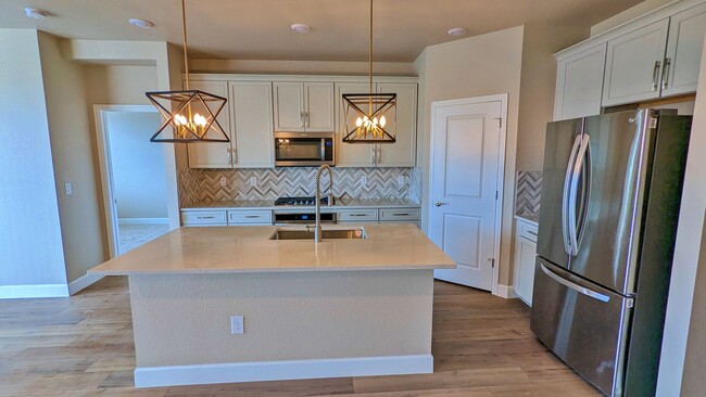 Building Photo - NEWER BUILD in Sunstone Village at Terrain...