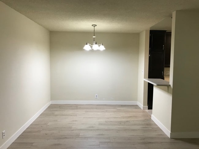 Dining Area - new wood floor - 325 S Doheny Dr