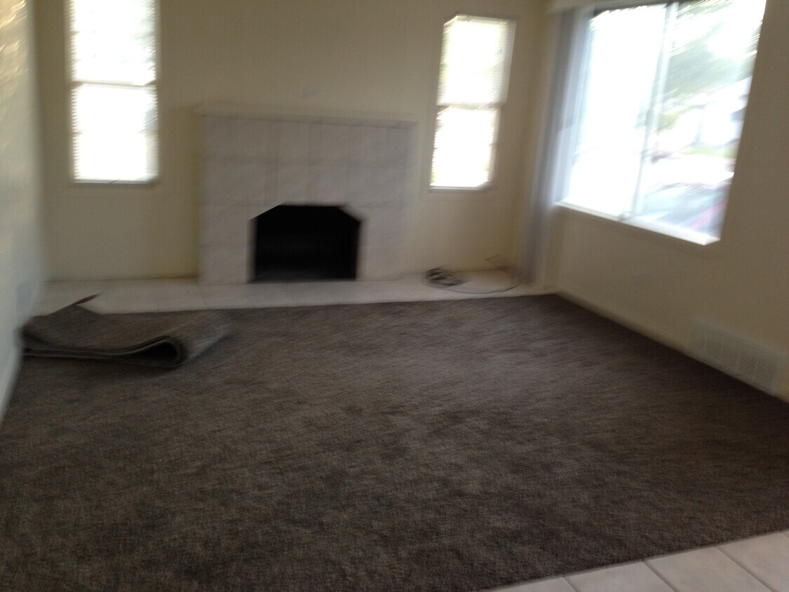 Living room with wood burning fireplace - 156 E 200 S