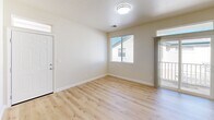 Located at 1024 Prospect Ave in Santa Rosa, CA, this 2-bedroom, 1-bathroom single-story home offers a practical and comfortable layout with thoughtful design details throughout. Light wood laminate flooring runs through the main living areas, lending a clean, bright aesthetic that complements the neutral wall tones found throughout the space.

The combined kitchen and dining area is well-appointed with warm honey-toned wood cabinetry offering generous storage, white appliances including a refrigerator, electric range, microwave, and dishwasher, along with a stainless steel sink. The adjacent living room benefits from multiple windows and a sliding glass door that opens to a private outdoor balcony, filling the space with natural light and greenery views.

Both bedrooms are carpeted and bathed in natural light from well-placed windows. The primary bedroom features a spacious double-door closet and direct proximity to the bathroom. The second bedroom also includes ample closet space. The shared bathroom is equipped with a tub and shower combination with sliding glass doors.

Additional features include a utility room, hallway connecting the main areas, and three closets for added storage throughout. The overall ambiance is clean, functional, and move-in ready.