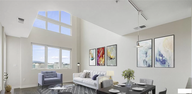 Living room with large windows and lots of natural lighting - 5501 De Marcus Blvd