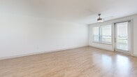 Located at 1100 Corinth St in Dallas, TX, this modern three-story home offers 2 bedrooms, 3 bathrooms, and a thoughtfully organized layout spread across three distinct floors. The ground level features an attached garage with an automatic opener, providing secure and convenient parking. The main living floor hosts an open-concept kitchen and living room with warm light wood flooring, recessed lighting, and a ceiling fan. The kitchen is well-appointed with grey cabinetry, stainless steel appliances, a subway tile backsplash, white quartz countertops, and a central island with a built-in sink. A bright office and a hallway complete this level. The upper floor is home to both bedrooms, each carpeted and equipped with ceiling fans and windows offering neighborhood views. The primary bedroom includes a walk-in closet with built-in shelving and rods. The bathrooms are finished with large-format grey marble-style tile, a soaking tub, and dark vanity cabinetry. Additional highlights include three closets, a balcony with outdoor views, and carpeted staircases connecting all three levels, creating a clean and cohesive modern aesthetic throughout.
