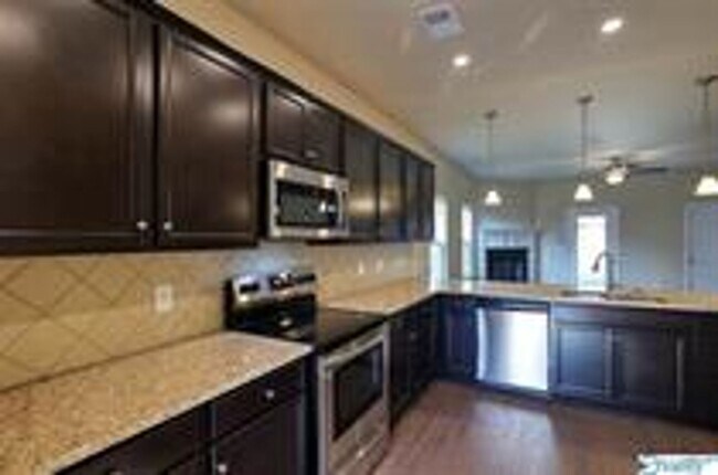 Foto del edificio - COMING SOON! Welcome to the Carlyle—where classic brick farmhouse charm meets a sleek, modern lif...