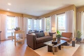 Located at 2230 Calle de Luna in Santa Clara, California, this well-appointed single-floor residence offers three bedrooms and two bathrooms within a thoughtfully designed layout. Light wood-tone flooring flows throughout the home, lending a clean, contemporary feel to every room.

The open-concept living, dining, and kitchen area serves as the heart of the home. Large windows flood the living space with natural light and frame views of the surrounding neighborhood. The kitchen features floor-to-ceiling white cabinetry, a subway tile backsplash, stainless steel appliances including a refrigerator, dishwasher, and microwave, and a light countertop with a breakfast bar overhang.

The primary bedroom offers dual windows with outdoor views, a walk-in closet, and a private en-suite bathroom featuring a glass-enclosed shower with decorative tile accents and a built-in niche. The additional bedrooms are well-sized with built-in closets and sliding doors. The second bathroom includes a full tub-shower combination with clean white tile surround and chrome fixtures.

A hallway-accessible laundry closet houses a stacked washer and dryer unit behind louvered bifold doors, maximizing space efficiency. Neutral wall tones and recessed lighting complete the modern, move-in-ready aesthetic of this Santa Clara residence.