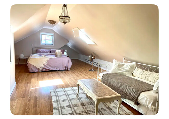 The master bedroom is located upstairs and features a California King sized bed - 186 Linwood St