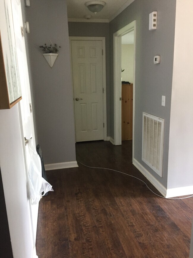 Hallway to bedrooms with hallway closet. - 6080 Old Dayton Pike