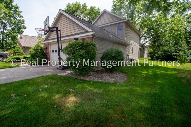 Building Photo - Spacious 3BR Townhome in Lowell | Nature Views & Maintenance-Free Living