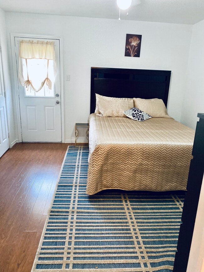 Master Bedroom with access to backyard. - 6748 Trail Lake Dr