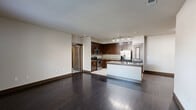 Located at 14700 Woodson Park Drive in Houston, TX, this single-floor, 2-bedroom, 2-bathroom residence offers a thoughtfully designed layout with modern finishes throughout. The open-concept living, dining, and kitchen area serves as the heart of the home, featuring rich dark hardwood flooring that adds warmth and sophistication. The kitchen is well-equipped with stainless steel appliances, including a gas range, microwave, and French door refrigerator, complemented by rich dark wood cabinetry, granite countertops, a tile backsplash, and a central island with a built-in sink — ideal for both cooking and entertaining. Track lighting illuminates the kitchen, while neutral-toned walls create a clean, cohesive aesthetic. The spacious primary bedroom features dark hardwood flooring and natural light from a large window, while the secondary bedroom offers plush carpeting, a ceiling fan, built-in shelving, and a dedicated desk area. Three closets, including a generously sized walk-in with wire shelving, provide ample storage throughout. Both bathrooms are finished with dark wood vanities, granite countertops, and tiled tub-shower combinations. A pantry adds further functional storage to round out this well-organized residence.