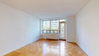 Located at 450 Walmer Rd in Toronto's Forest Hill neighbourhood, this one-bedroom, one-bathroom unit offers a well-organized layout across a single floor. Warm-toned parquet flooring runs throughout the living spaces, adding a classic character to the interior.

The living room is a bright, open space anchored by large floor-to-ceiling windows and a sliding door that leads to a private balcony. The balcony offers pleasant views of the surrounding urban greenery and cityscape, allowing abundant natural light to fill the room. A wall-mounted radiator provides in-unit heating.

The bedroom is a comfortably sized private retreat, featuring the same parquet flooring and a large window that frames views of the neighbouring buildings and tree canopy, keeping the room well-lit throughout the day.

The kitchen is practical and well-appointed, featuring white cabinetry with raised-panel detailing, marble-look countertops, and a white electric range — offering a clean and functional cooking space.

The bathroom includes a full soaking tub and shower combination, with beige ceramic wall tiles accented by a decorative tile border, giving the space a neat, classic finish.

Overall, the unit presents a clean, functional living space with consistent design elements throughout, situated in a well-established Toronto neighbourhood.