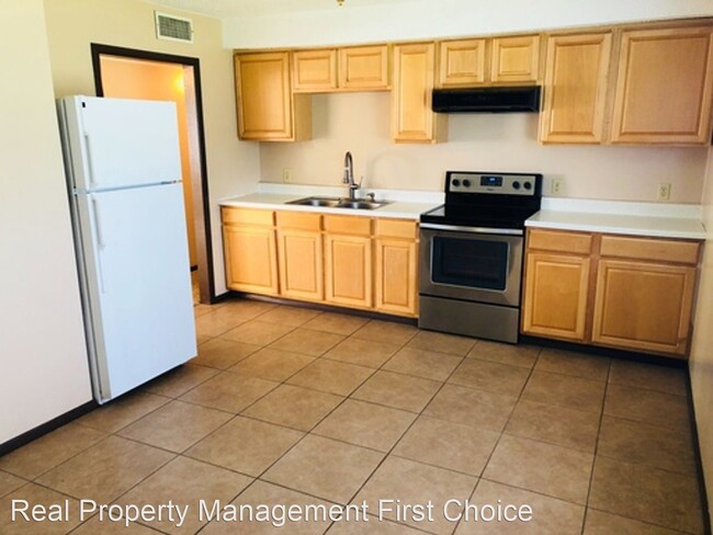Building Photo - 3 br, 1.5 bath House - 402 42nd Circle West