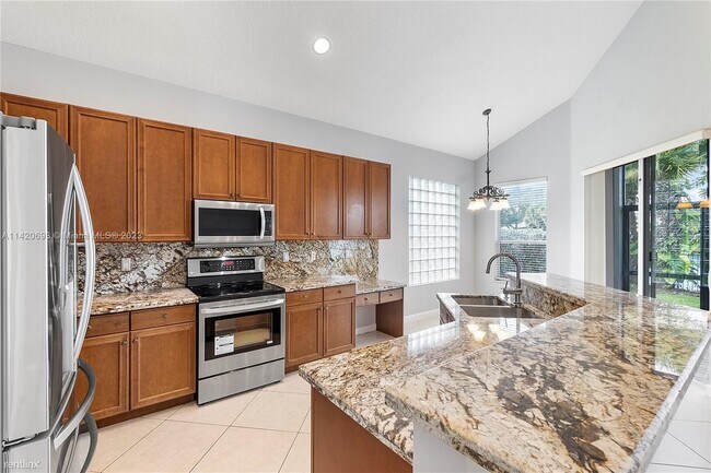 Foto del edificio - 4 br, 3 bath House - 7791 NW 125th Ln