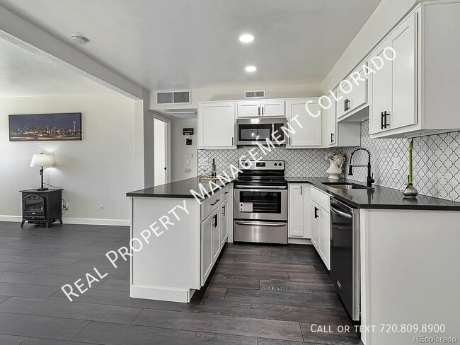 Building Photo - 3613 S Sheridan Blvd Unit 12