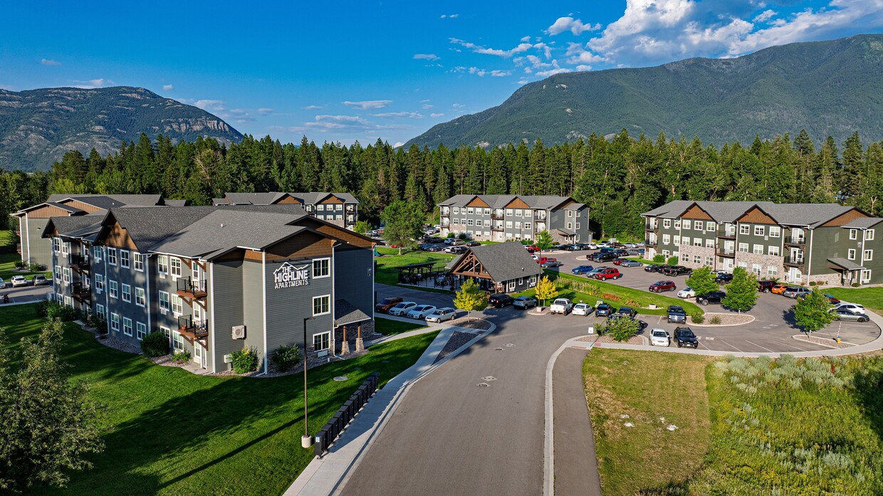 Charming apartment complex nestled amidst lush greenery with scenic mountain views - The Highline Apartments