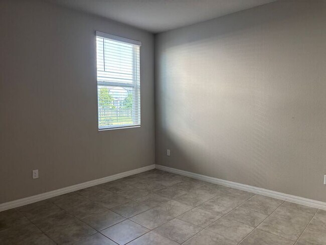 Building Photo - Like-New 4 Bedroom 3 Bath with Pond View & Two Living Spaces — Minutes to South Lake Nona