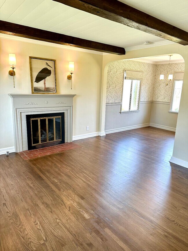 Open living room with gas fireplace. - 216 E 45th St