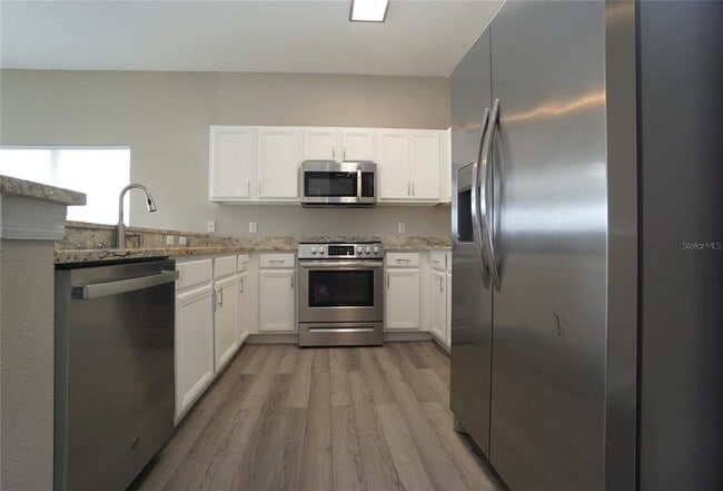 Building Photo - 9468 Leatherwood Ave