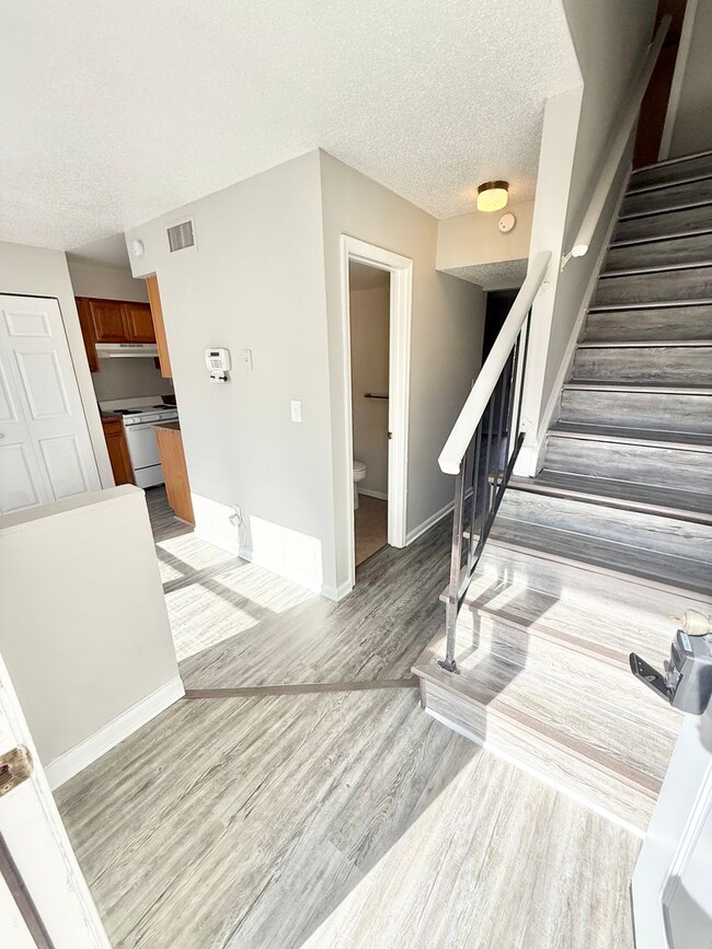 Building Photo - *** RENT READY!! Newly remodeled townhome! ALL Laminate.
