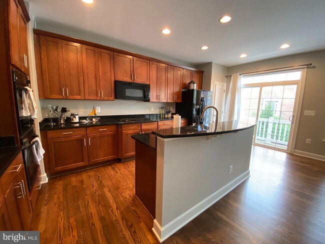 Photo - Bright & Spacious End-Unit Townhouse with Two-Car Garage!