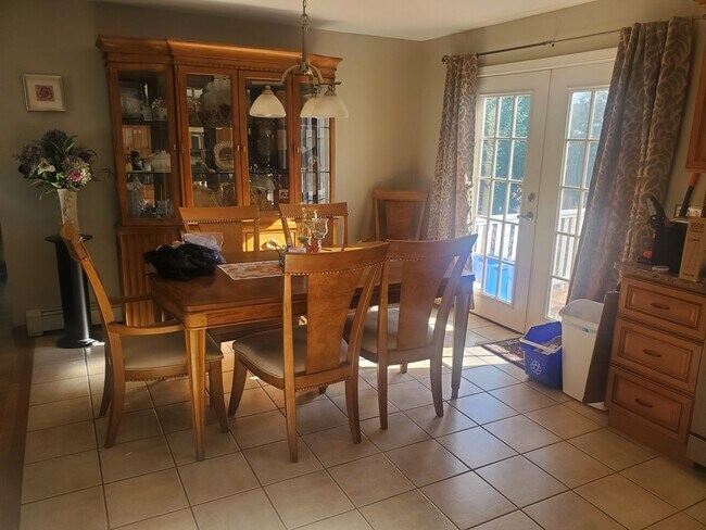 space for dining table with exit to back deck - 1470 Cranston St