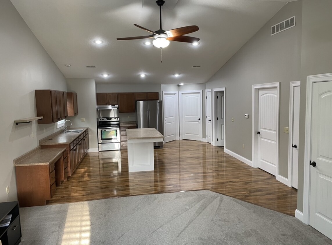 Vaulted ceiling kitchen view with island - 107 Washington St