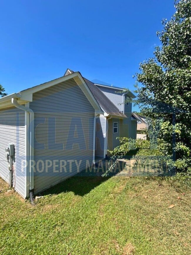 Building Photo - Charming three-bedroom home with carport!