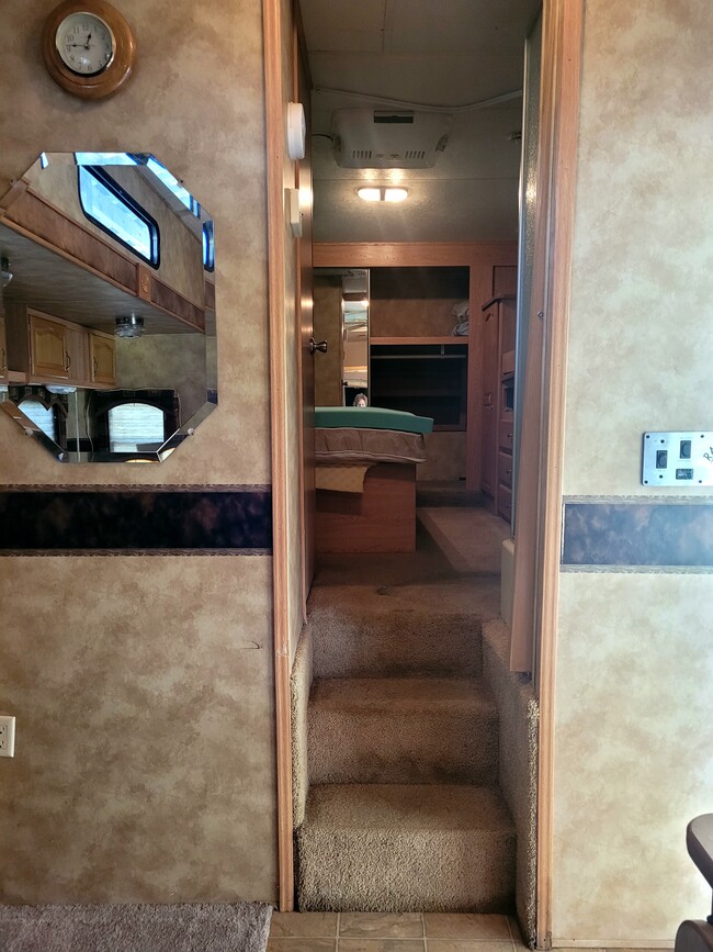 Looking into 5th wheel area-bathroom and bedrm with queen bed - 123 Gordon Rd