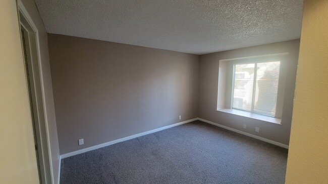 Primary Bedroom - Sunset Springs Apartments