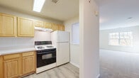 Located at 55 S Hyde Ave in Iselin, NJ, this one-bedroom, one-bathroom unit offers a well-organized and functional layout across a single floor. The open-concept living and dining area is generously proportioned, featuring soft carpet flooring, neutral wall tones, and a pass-through window that connects seamlessly to the kitchen, enhancing the sense of openness throughout. A flush-mount light fixture illuminates the living space, which benefits from a clean, bright ambiance.

The kitchen is thoughtfully designed with light wood cabinetry offering abundant upper and lower storage, white countertops, a gas range, a full-size refrigerator, a dishwasher, and a double-basin sink — all finished with easy-care hardwood-style flooring. A skylight-style ceiling fixture adds brightness to the cooking area.

The bedroom is a comfortable, carpeted retreat featuring a large window with outdoor tree views, a wall-mounted heater, and a full-width sliding closet. Additional storage is provided by three closets throughout the unit. A private balcony, in-unit laundry, a utility room, and a full bathroom round out this well-appointed home, making it a practical and comfortable residence in Iselin.