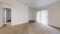 Located at 7575 Power Inn Rd in Sacramento, CA, this single-floor residence offers three bedrooms and two bathrooms within a well-organized, efficient layout. The living area features neutral-toned carpet and large sliding glass doors dressed with vertical blinds, allowing natural light to brighten the space. A dedicated entry door provides a clear transition into the home.

The galley-style kitchen is outfitted with white cabinetry featuring brushed gold hardware, light wood-look vinyl flooring, a double-basin sink, a full-size refrigerator, and a coil-top electric range — making efficient use of the available space.

Each of the three bedrooms is finished with plush beige carpet and crisp white walls. The bedrooms include sliding or hinged closet doors and windows with vertical blinds for light control. The primary bedroom offers a comfortable footprint with direct access to the hallway.

Both bathrooms are finished with wood-look vinyl flooring, white vanity cabinetry with stone-look countertops, and brushed nickel fixtures. One bathroom features a tub-shower combination, while the second includes a glass-enclosed walk-in shower, providing practical options for residents.

A central hallway connects the bedrooms and bathrooms, contributing to a logical and accessible flow throughout the home.