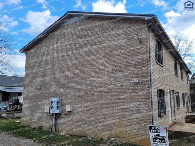 Building Photo - Alluring Brick Home