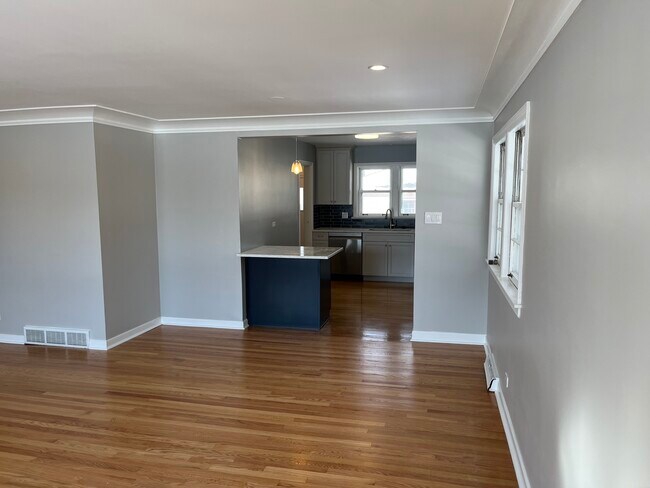 Living room looking at island and Kitchen - 6558 N Olympia Ave