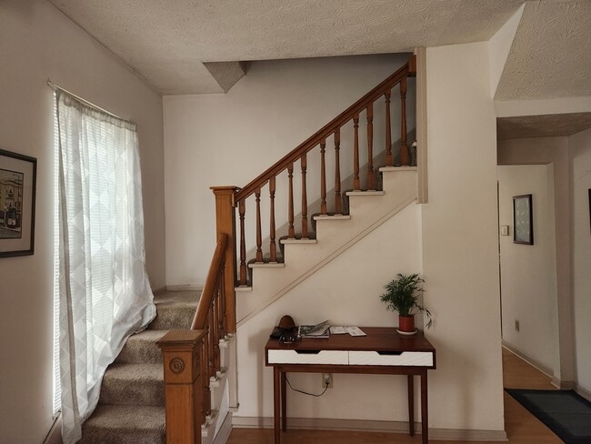 Front Foyer with Pine staircase - 224 W 3rd Ave