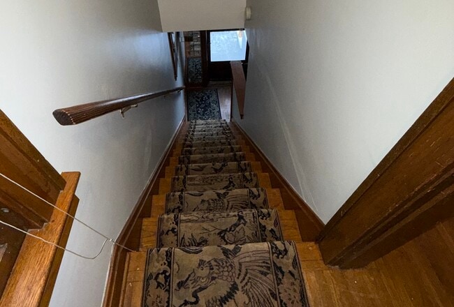 View from upstairs apartment down to front door - 40 W Tompkins St