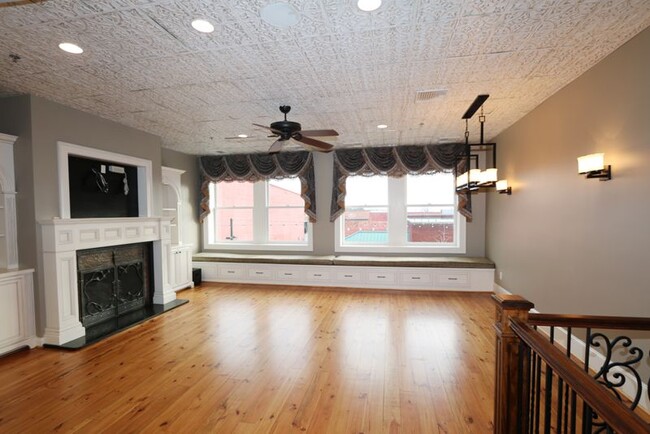 Living Room with Main Street Views - 114 Trade St