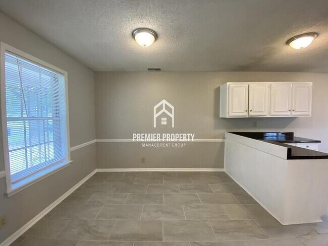Building Photo - Adorable 4 bedroom 2 bath brick home.