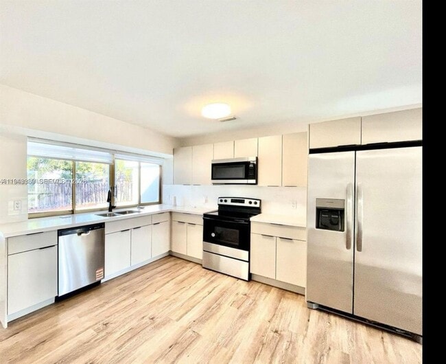 Building Photo - 6729 Petunia Dr