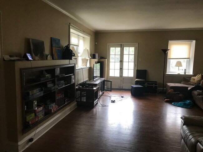 This is the living room which has a couch, television, and lots of games. - 2401 N 57th St